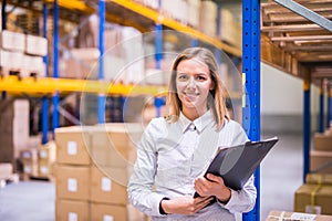 Portrait of a woman warehouse worker or supervisor. photo