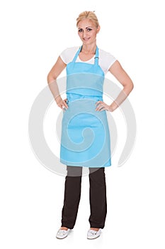 Portrait of woman wearing kitchen apron