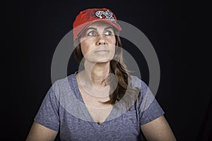 A portrait of a woman wearing a red hat