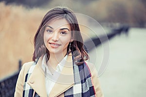 Portrait of a woman with a white teeth and perfect smile outdoors