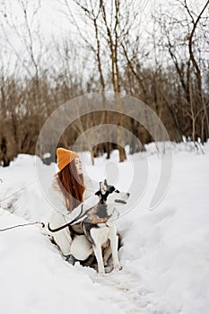 portrait of a woman winter outdoors with a dog fun nature fresh air