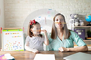 Mother and daughter enjoying homeschooling together