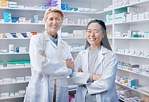 Portrait, women teamwork and pharmacists with arms crossed in pharmacy, drugstore or shop. Healthcare, medication store