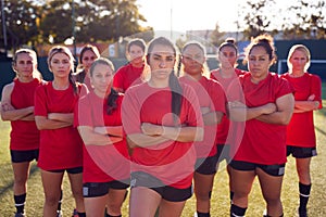 Portrait Of Womens Football Team Training For Soccer Match On Outdoor Astro Turf Pitch photo