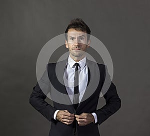 Portrait of a a wondering gentleman in business attire.