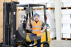 portrait of a worker in a goods warehouse - storage and transport of goods by mail order