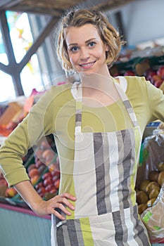 Portrait worker in green grocers photo