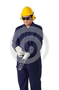 Portrait of a worker in Mechanic Jumpsuit is Removing gloves isolated on white background