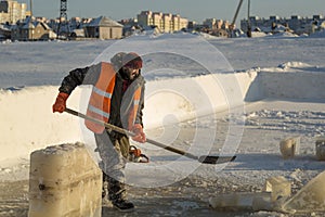 Portrait of a worker with a shovel in his hands