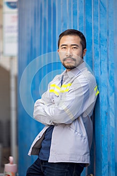 Portrait of worker or technician smile and stand container