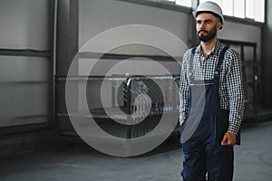 portrait of a worker in uniform at the factory
