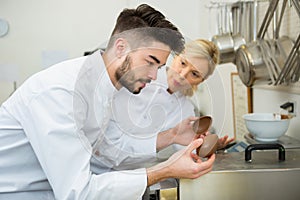 portrait workers making chocolate eggs