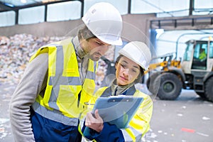 portrait workers in recycling warehouse