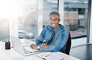 Portrait, working and black man by computer in office, workspace and desk happy in creative career. Happiness