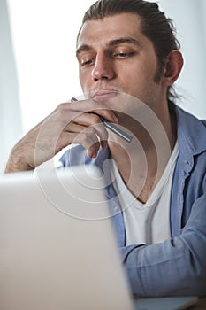 Portrait of working man at his home