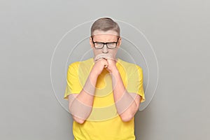 Portrait of worried and anxious mature man with glasses