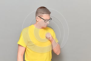 Portrait of worried and anxious mature man with glasses