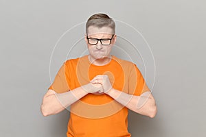 Portrait of worried and anxious mature man with glasses