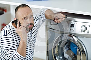 portrait worried man using phone