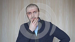 Portrait of worried young man at workplace. Stress concept