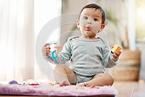 Portrait, wow and surprised baby with toys on floor for fun, playing and game at home. Face, shock and toddler boy with