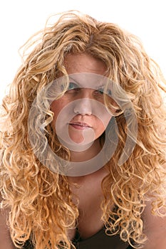Portrait of wrinkly young woman with long blonde curly hair
