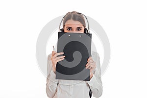 Portrait of young adorable call center worker girl with headphones and microphone posing isolated on white background