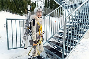 Portrait of young adult female brave skier tourist with skiing equipment enjoy having fun going to ride extreme