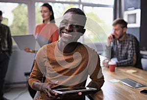 Portrait of a young African American business man in office