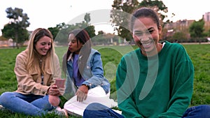 Portrait of young african american female woman smiling at camera outdoors