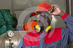Portrait Of Young African American Worker In Personal Protective Equipment In Industrial Interior