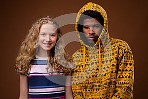Portrait of young African man and Caucasian teenage girl