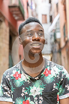 Portrait of young african man, outdoor. Student and athletic man.