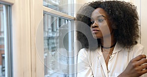 Portrait young Afro American woman sad looking window upset sitting 4k close up beautiful.