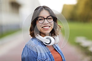 Portrait Of Young Arab Student Female In Stylish Eyeglasses Standing Outdoors