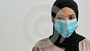 Portrait of young arabian woman in protective mask