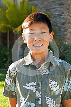 Portrait of young kid Asian boy with tooth braces.