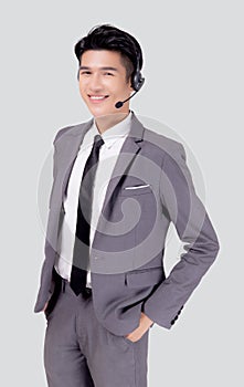 Portrait young asian business man call center wearing headset isolated on white background.