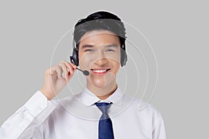 Portrait young asian business man call center wearing headset isolated on white background.