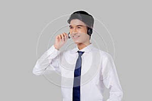 Portrait young asian business man call center wearing headset isolated on white background.