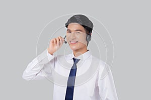 Portrait young asian business man call center wearing headset isolated on white background.