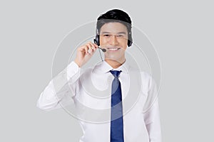 Portrait young asian business man call center wearing headset isolated on white background.