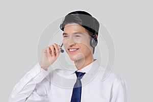 Portrait young asian business man call center wearing headset isolated on white background.