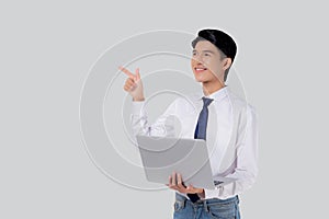 Portrait young asian business man standing work on laptop computer to internet online isolated white background.
