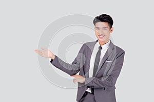 Portrait young asian business man in suit presenting isolated on white background, advertising and marketing, executive and