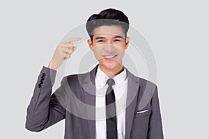 Portrait young asian business man in suit with smart thinking idea with intelligent isolated on white background.