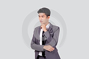 Portrait young asian business man in suit with smart thinking idea isolated on white background.