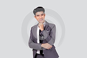 Portrait young asian business man in suit with smart thinking idea isolated on white background.