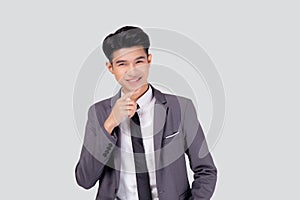 Portrait young asian business man in suit with smart thinking idea isolated on white background.