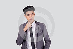 Portrait young asian business man in suit with smart thinking idea isolated on white background.